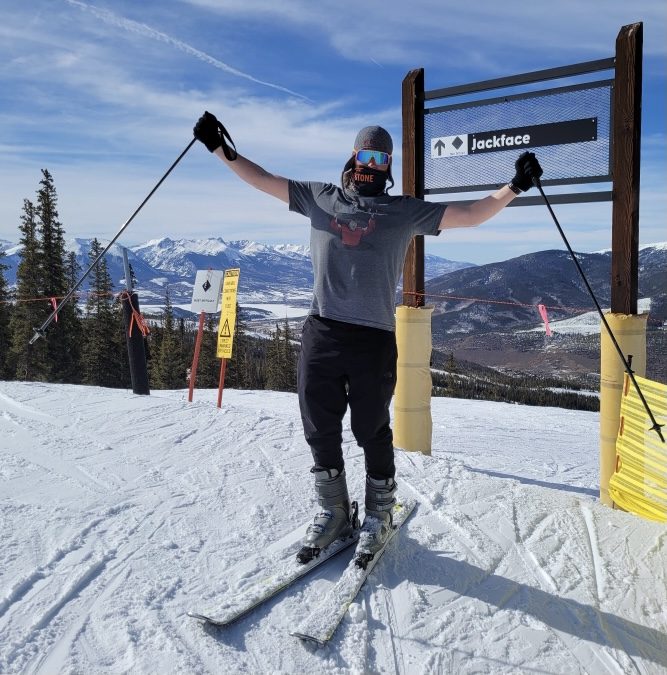 Skis on at the top of Jackface